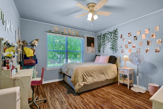 bedroom with ceiling fan, wood-type flooring, and crown molding