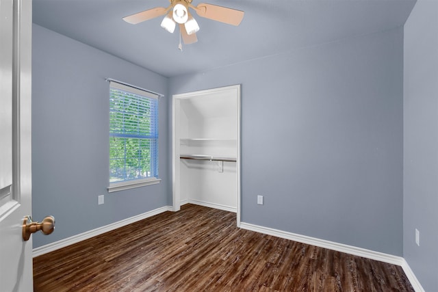 unfurnished bedroom featuring a closet, ceiling fan, and dark hardwood / wood-style flooring