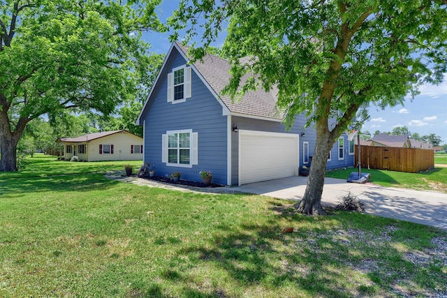 exterior space with a front yard and a garage