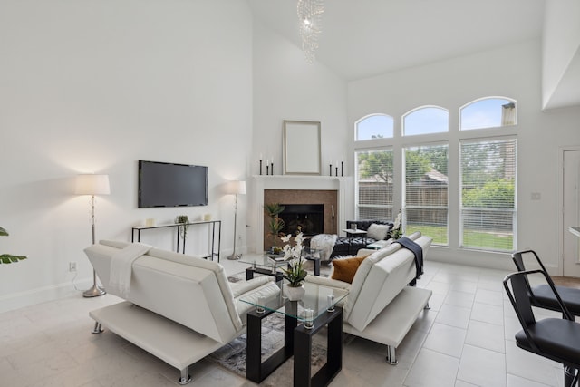 tiled living room featuring a towering ceiling