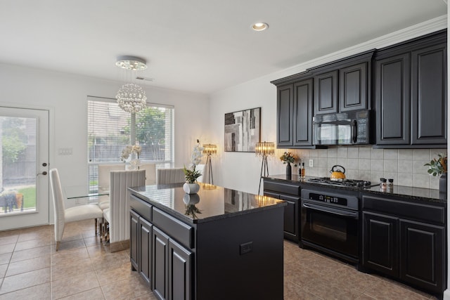 kitchen featuring light tile patterned flooring, a kitchen island, tasteful backsplash, and black appliances