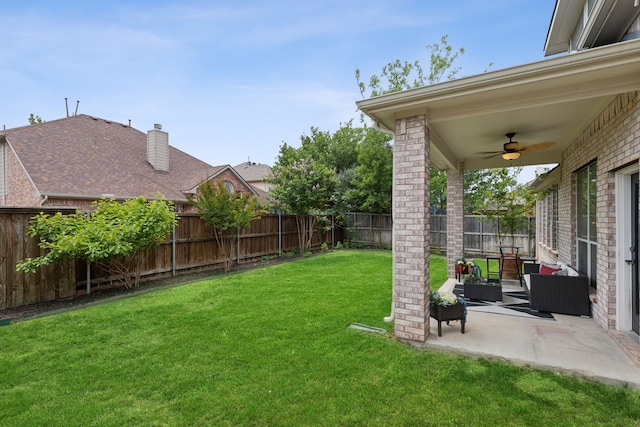 view of yard featuring a patio, an outdoor hangout area, and ceiling fan