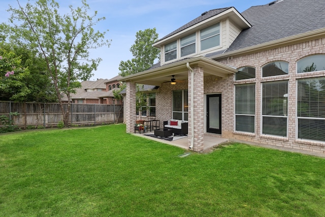 view of yard featuring a patio and ceiling fan