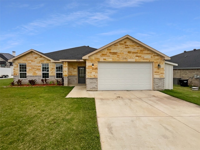 single story home featuring a garage and a front yard