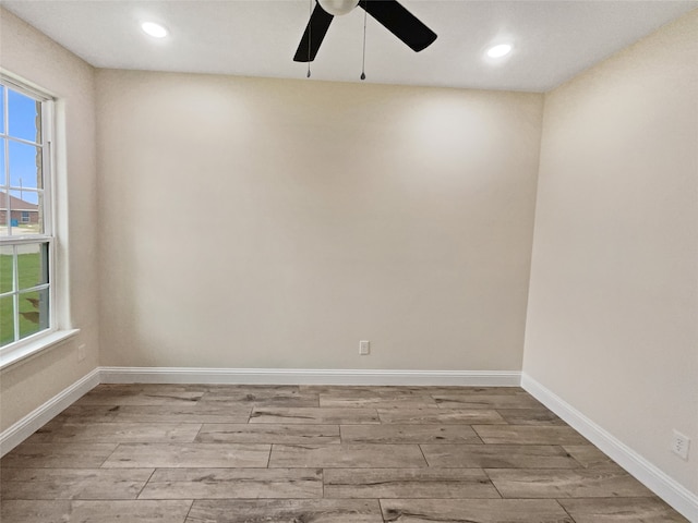 unfurnished room with wood-type flooring and ceiling fan