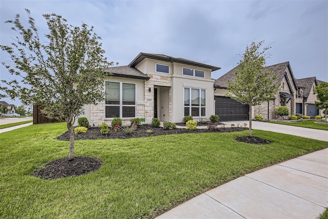 prairie-style home with a garage and a front yard