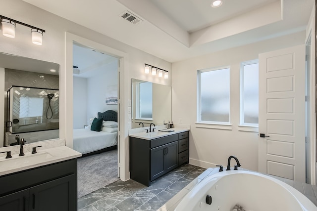 bathroom featuring a tray ceiling, plus walk in shower, and vanity