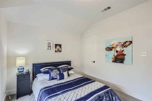 bedroom featuring vaulted ceiling and light carpet