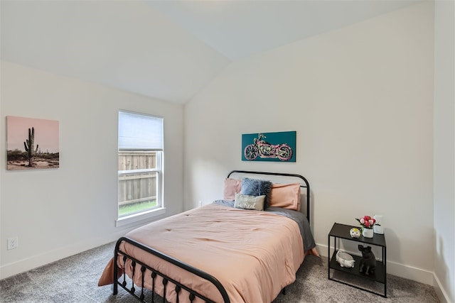 bedroom featuring vaulted ceiling and carpet floors