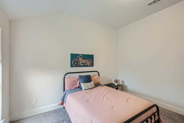 bedroom featuring vaulted ceiling and carpet floors