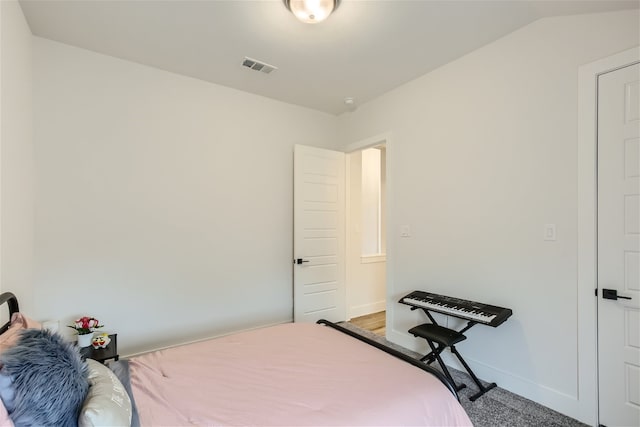 bedroom with lofted ceiling