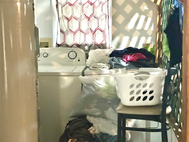 washroom with washing machine and clothes dryer