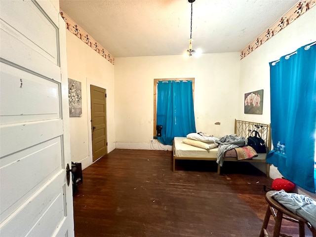 bedroom featuring dark wood-type flooring