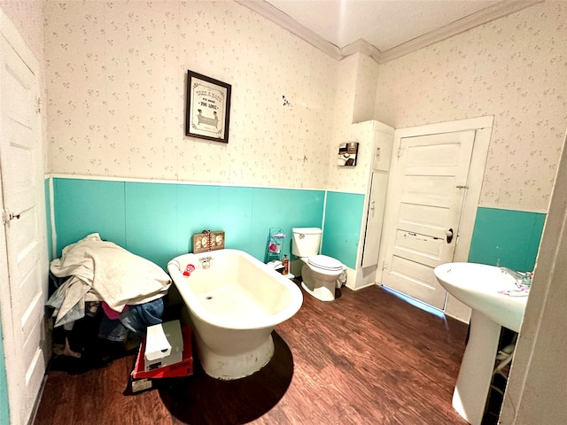 bathroom with hardwood / wood-style floors, toilet, and crown molding