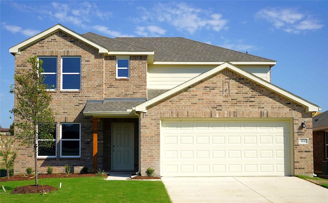 414 Aberdeen Dr, Ferris, TX 75125 - view of front of home with a garage and a front lawn