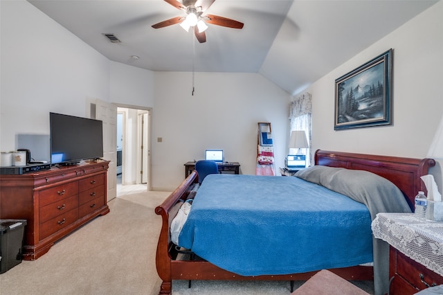 carpeted bedroom with ceiling fan and vaulted ceiling