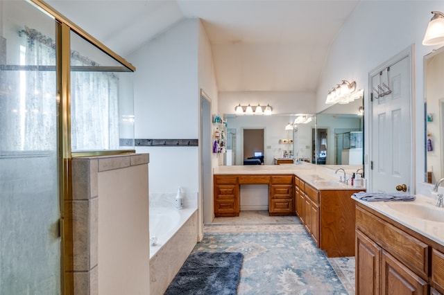 bathroom featuring tile floors, lofted ceiling, separate shower and tub, and dual bowl vanity