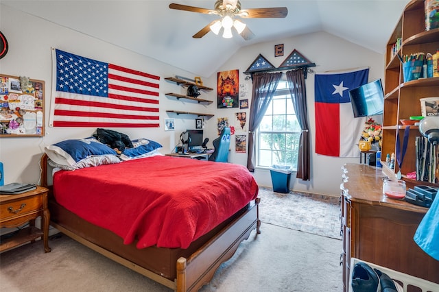 bedroom featuring carpet flooring, vaulted ceiling, and ceiling fan