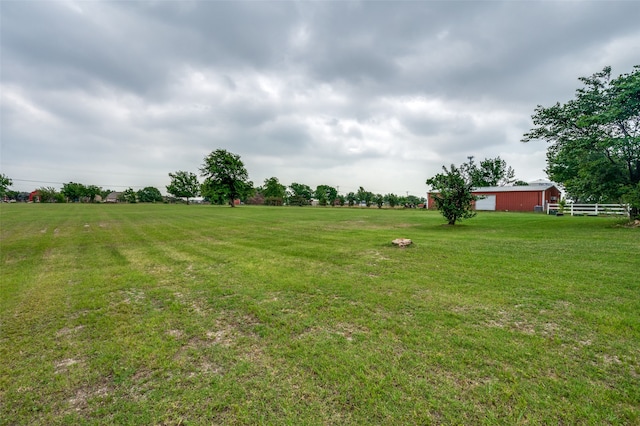 view of yard with a rural view