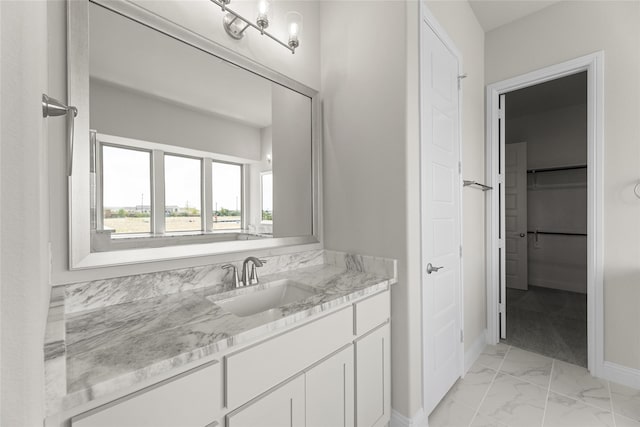 bathroom with tile patterned flooring and vanity