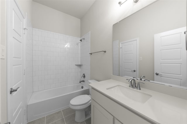 full bathroom with toilet, tiled shower / bath combo, vanity, and tile patterned floors