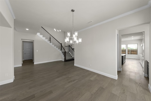 unfurnished dining area with dark hardwood / wood-style floors, crown molding, and an inviting chandelier