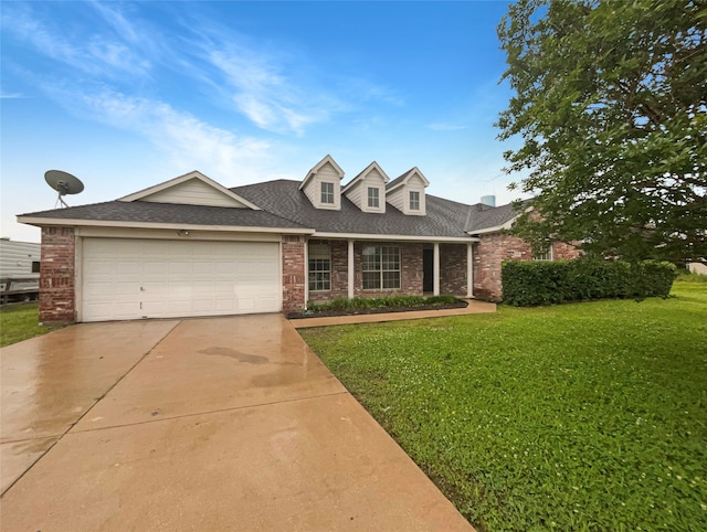 view of front of house featuring a front lawn and a garage