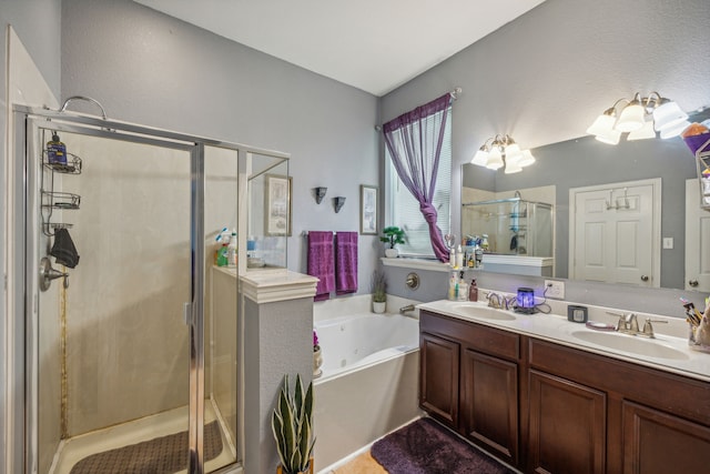 bathroom with independent shower and bath and double sink vanity