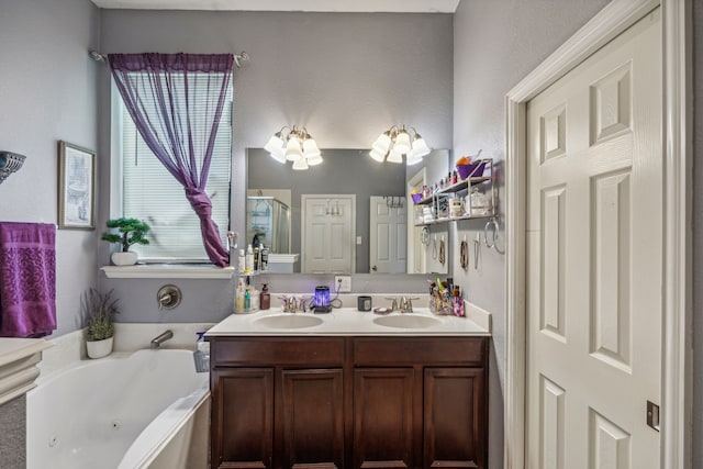 bathroom with a washtub and double sink vanity