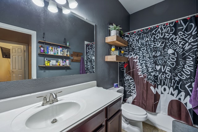 full bathroom featuring tile floors, shower / bath combo with shower curtain, toilet, and vanity