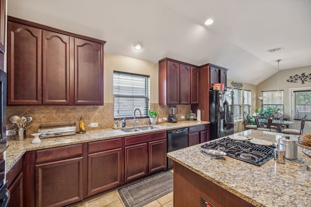 kitchen featuring tasteful backsplash, black appliances, light tile floors, sink, and lofted ceiling