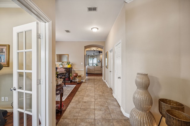 corridor with light tile floors