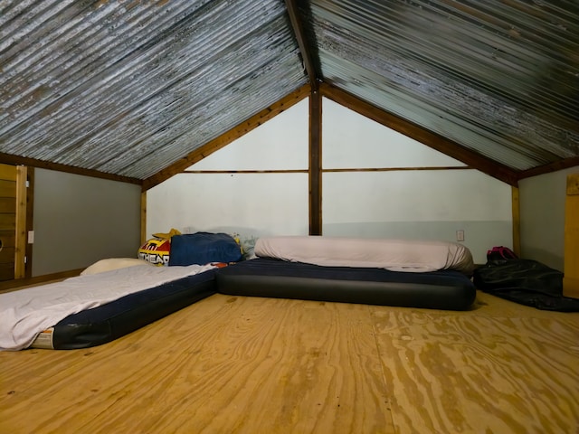 unfurnished bedroom with vaulted ceiling