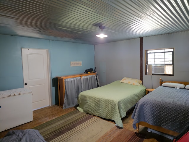 bedroom featuring hardwood / wood-style flooring