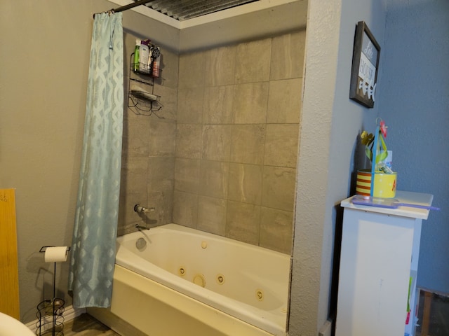 bathroom with shower / bath combination with curtain