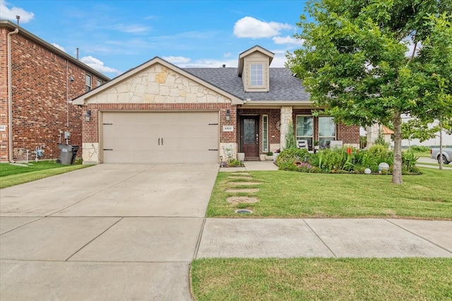 view of front of property with a garage and a front lawn