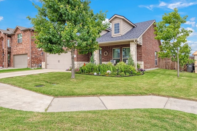 view of front of property with a garage and a front lawn