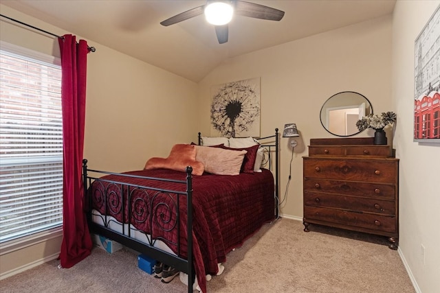 bedroom with lofted ceiling, light carpet, and ceiling fan