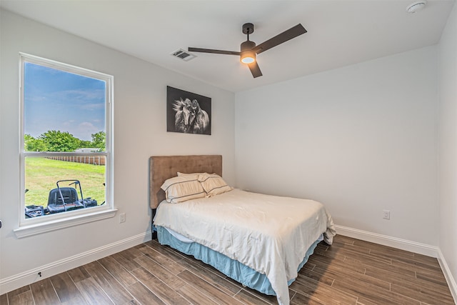 bedroom featuring ceiling fan and dark hardwood / wood-style flooring