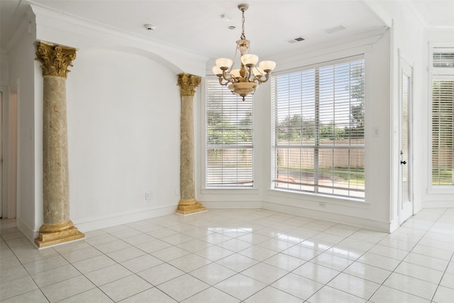 interior space featuring decorative columns, crown molding, and light tile floors