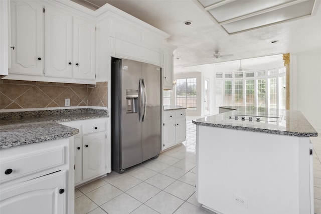 kitchen featuring stainless steel refrigerator with ice dispenser, white cabinetry, and ceiling fan