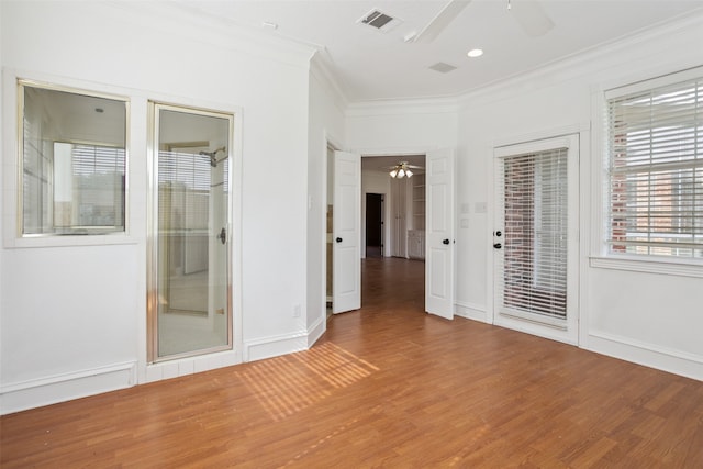 unfurnished bedroom featuring ceiling fan, crown molding, hardwood / wood-style flooring, and access to exterior