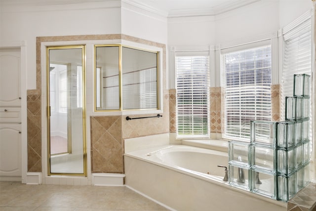 bathroom with tile flooring, plenty of natural light, ornamental molding, and plus walk in shower