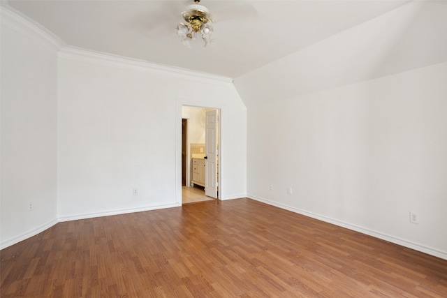 spare room featuring wood-type flooring, ornamental molding, and ceiling fan