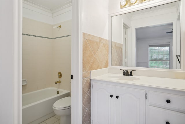 full bathroom featuring toilet, tiled shower / bath combo, tile flooring, ornamental molding, and vanity