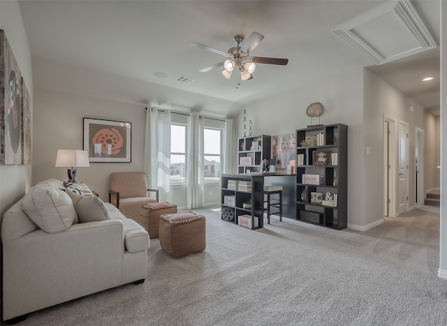 carpeted living room featuring ceiling fan