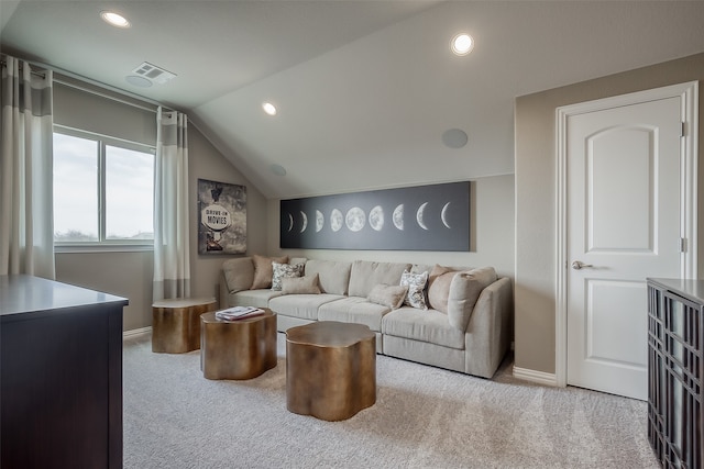 living room with light colored carpet and vaulted ceiling