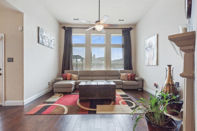 living room with ceiling fan and hardwood / wood-style floors