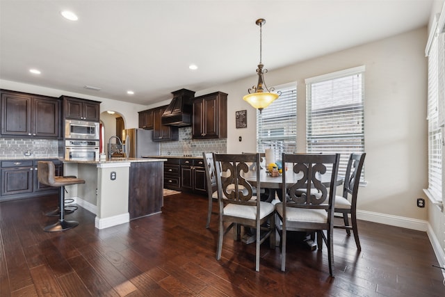 dining area featuring dark hardwood / wood-style floors