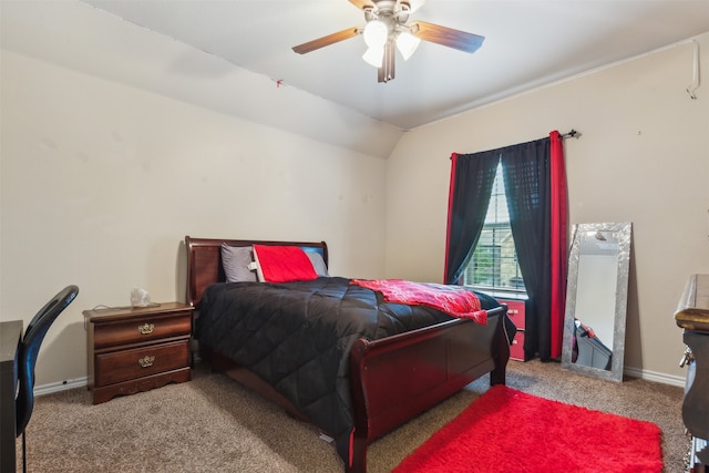 carpeted bedroom with ceiling fan and vaulted ceiling